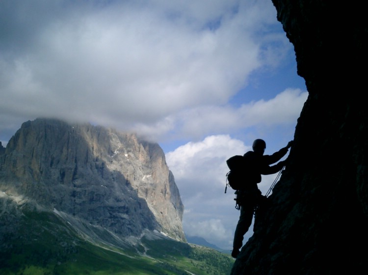 Climbing on 2nd sella tower with Sassolungo in the background.   Photo: Andreas Bengtsson
